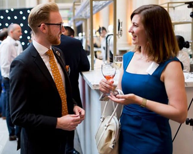 Photo of two people meeting at an event