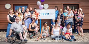 A group of people standing outside BCRM